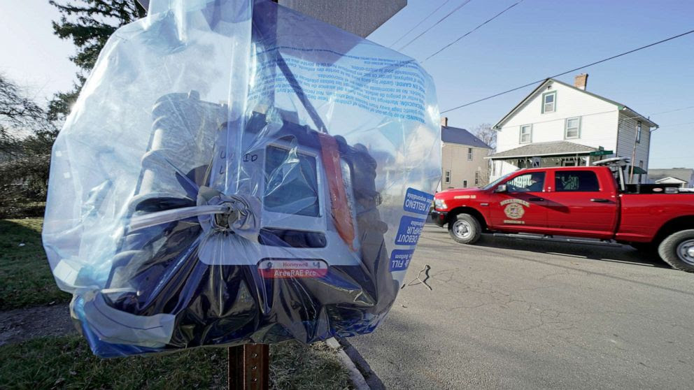  A air quality monitoring device hangs on a stops sign in East Palestine, Ohio, as the cleanup continues after the derailment of a Norfolk Southern freight train over a week ago, Feb. 15, 2023.